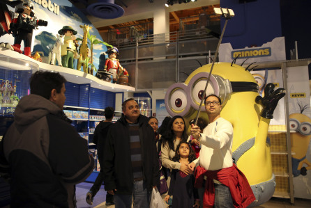 Mandatory Credit: Photo by Mary Altaffer/AP/REX/Shutterstock (6081736b)
A family member takes a selfie with others at the Toys R Us store in New York's Times Square, . Fourteen years after it began wowing millions of tourists with its indoor 60-foot Ferris wheel and a growling 20-foot Tyrannosaurus, the giant Toys R Us flagship store in Times Square closes its doors Wednesday
Times Square Toy Store, New York, USA